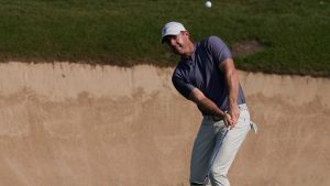 Abu Dhabi HSBC Championship: Rory McIlroy hit by triple bogey late in second round as Paul Waring breaks course record