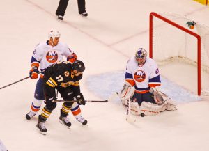 Hughes’ Double Strikes Lead Devils to Thrilling Overtime Victory Over Islanders